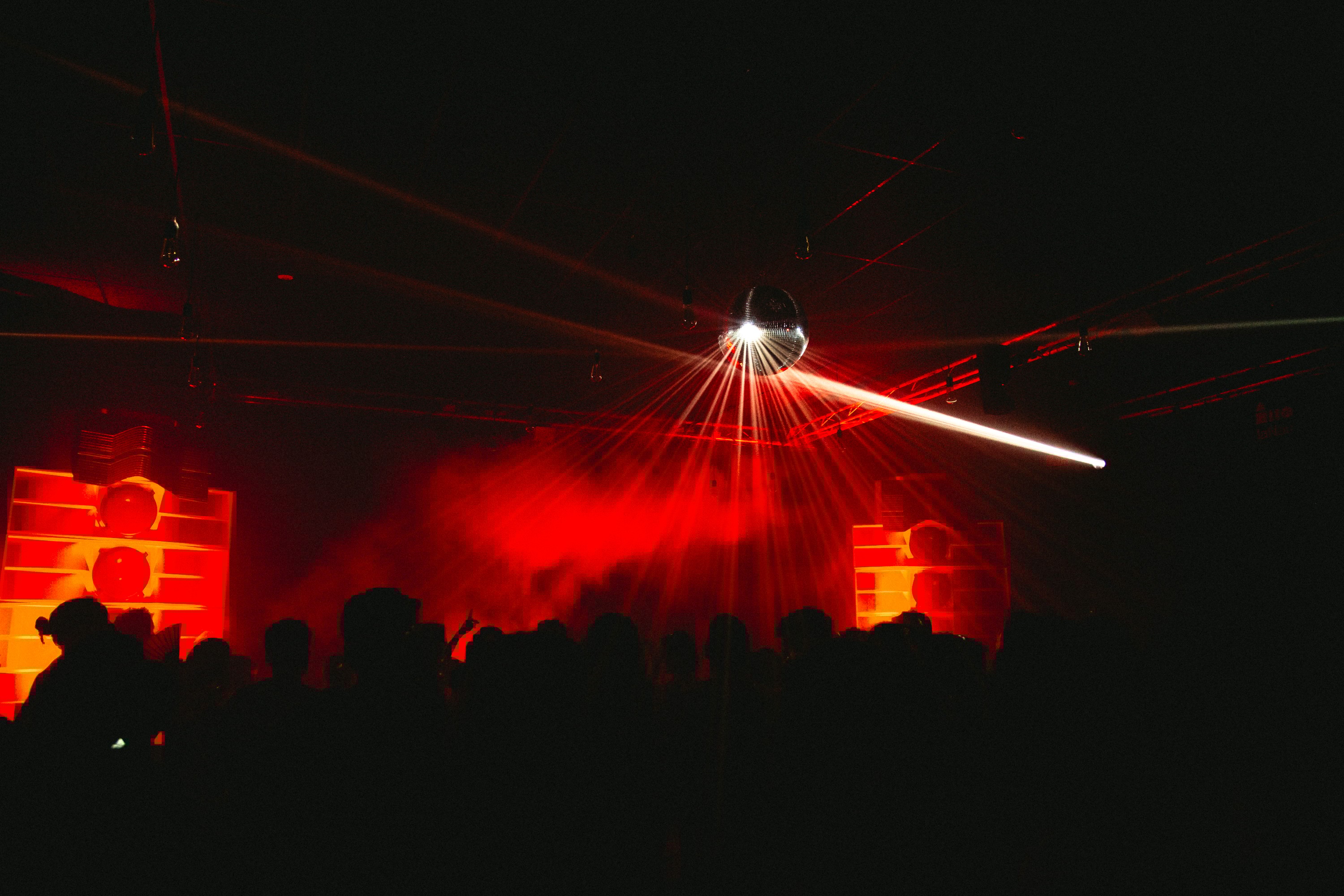 Woman gazing through two glasses of water